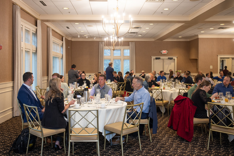 a group of business professionals at a roundtable event